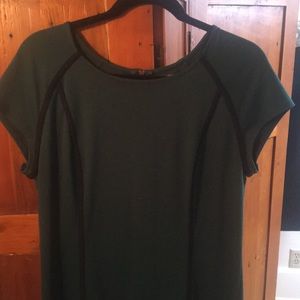 Dark green dress with black piping